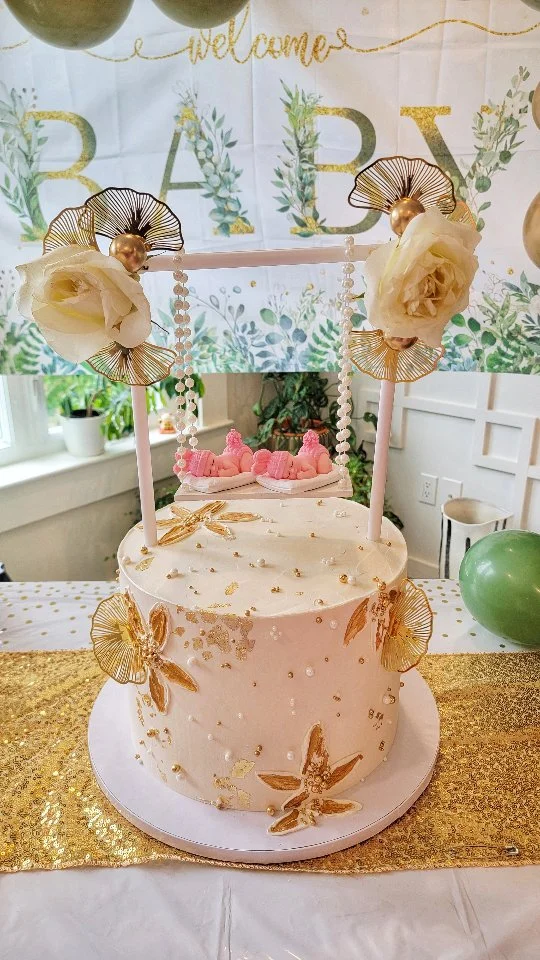 🎉 When your friend’s having twin girls and you’re in charge of the cake… NO PRESSURE, right? 😅

For her baby shower, I wanted to create something extra special! She’s all about the gold vibes, so I took that as my cue and took inspiration from the elegant @dolce_cakestudio (thank you!) to whip up this beauty. ✨

Shoutout to:
💛 My work bestie Sonn, who crafted the beautiful swing base.
💛 My husband, who patiently helped me build the swing.

The best part? After finishing, I told him, “This is SO Arpita!” And next day her outfit magically matched the cake — white dress, pearl details... it was like the universe conspired! ✨👗🎂

Inside was her all-time favorite — classic black forest 🍒🍫 🎂

Everyone was obsessed with the cake — the look AND the taste! Honestly, I think I nailed it this time. 😎💯
.
.
.
.
.
.
.
.
.
.
#BabyShowerCake #TwinGirls #BlackForestCake #smallbusiness #ZnLbakes #cake #cakedecorating #bakinglove #instacake #cakestagram #cakesofinstagram #cakeoftheday #cakelover #cakedesign #cakegram #instacakes #homebaker #igers #igersUSA #igersnewengland #igersmassachusetts #igersMA #igerswestford #westfordMA #westfordMAbaker #NewEnglands #MA